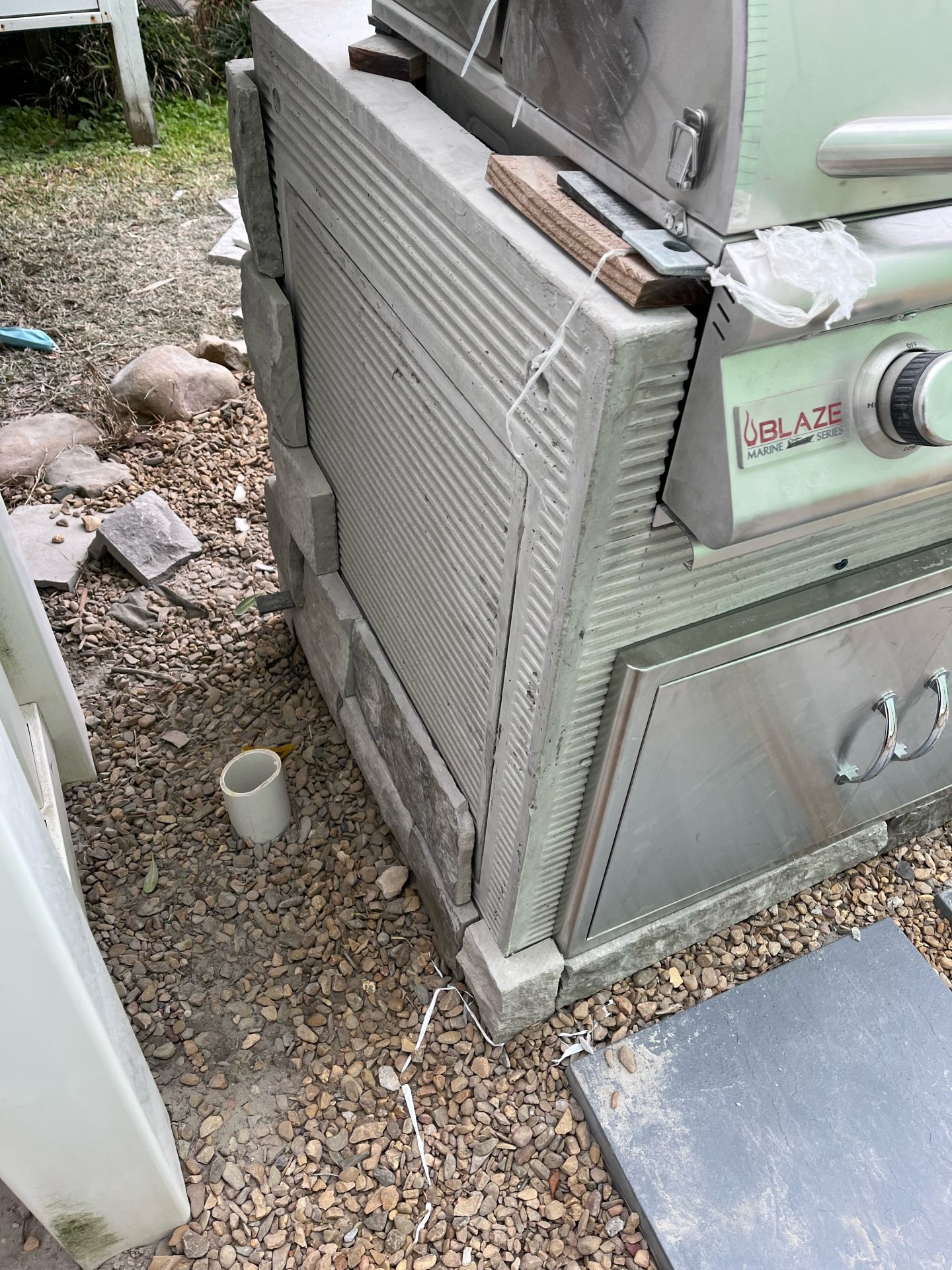 Outdoor grill with stone and metal design