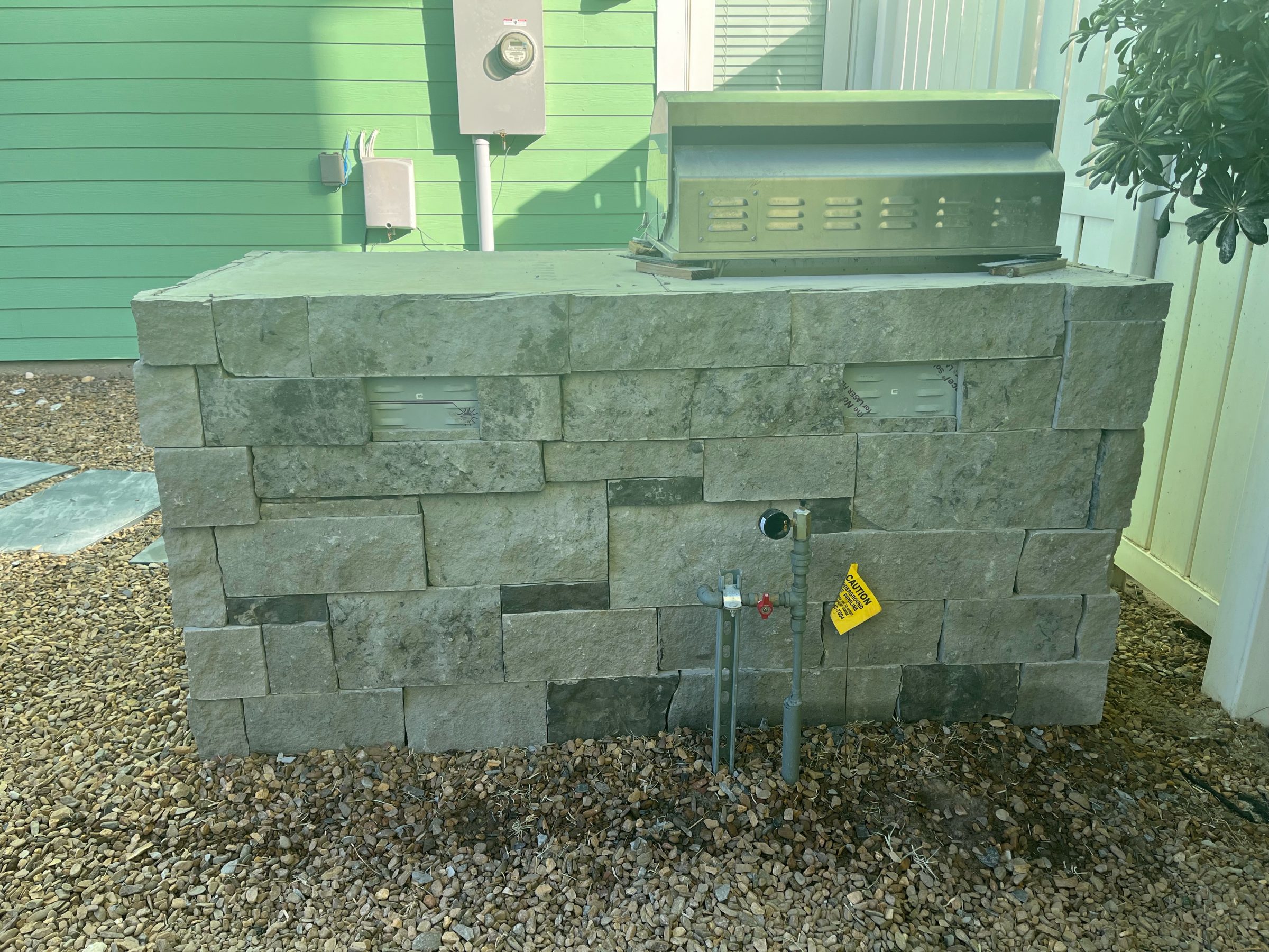 Backyard electrical utility box with brick enclosure