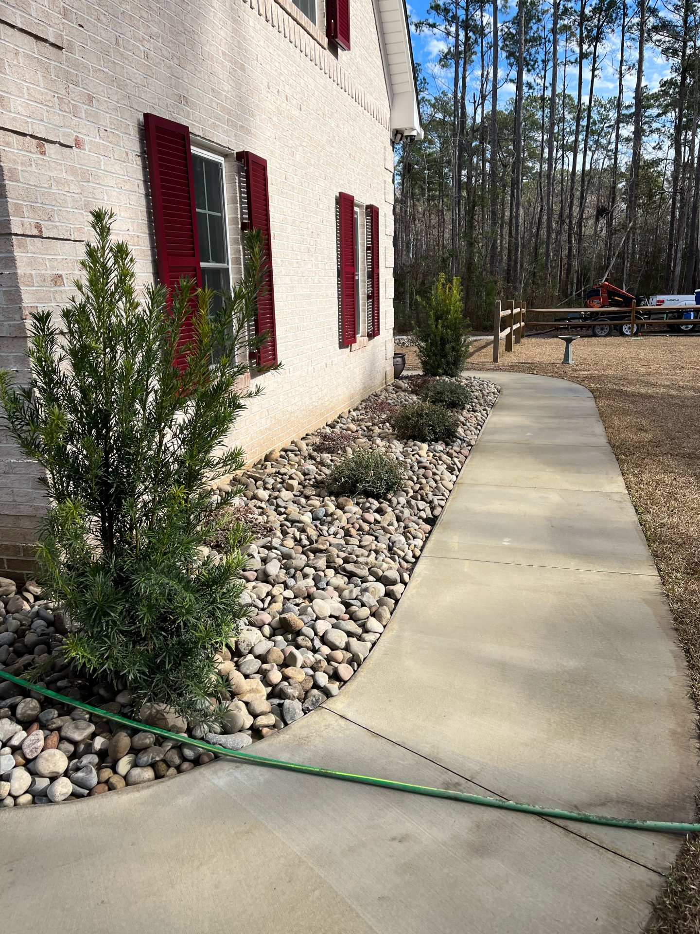 House exterior with walkway and stone landscaping