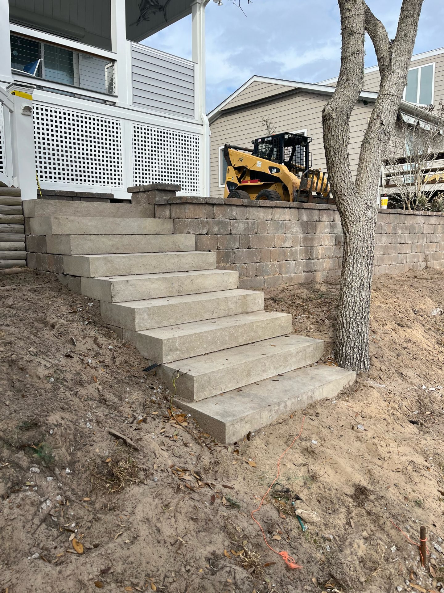 Concrete steps with tree and construction vehicle