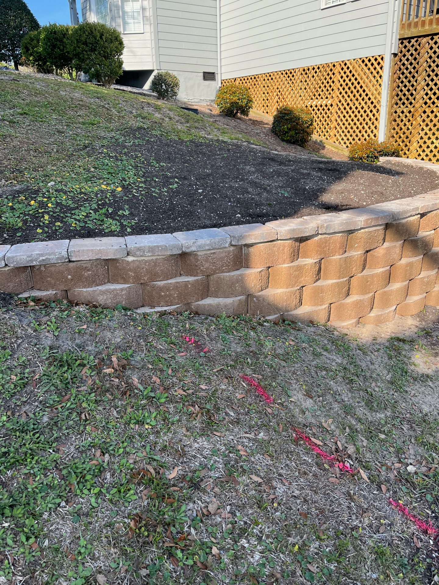 Retaining wall with garden on sloped yard