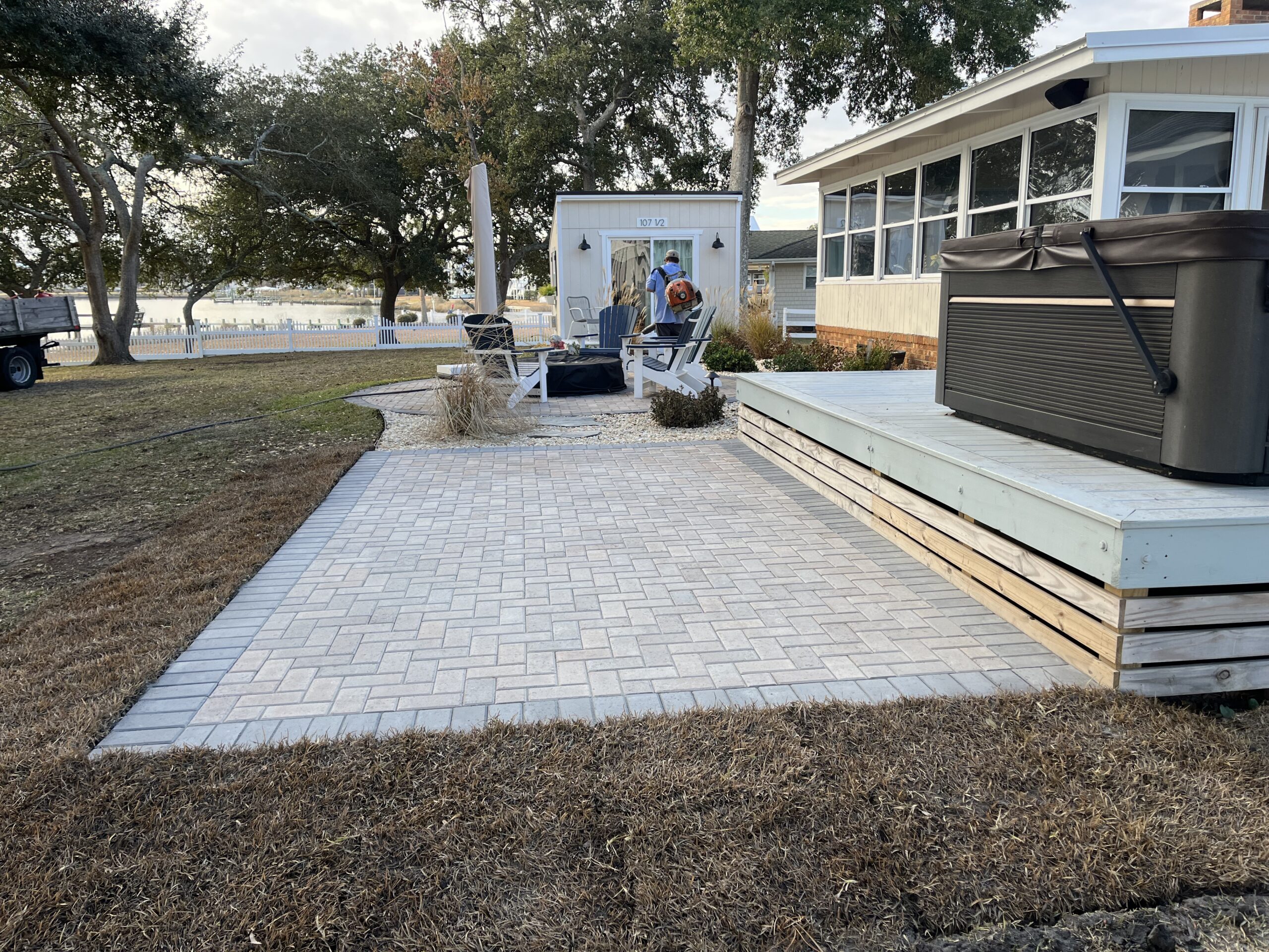 Patio with hot tub and outdoor furniture.