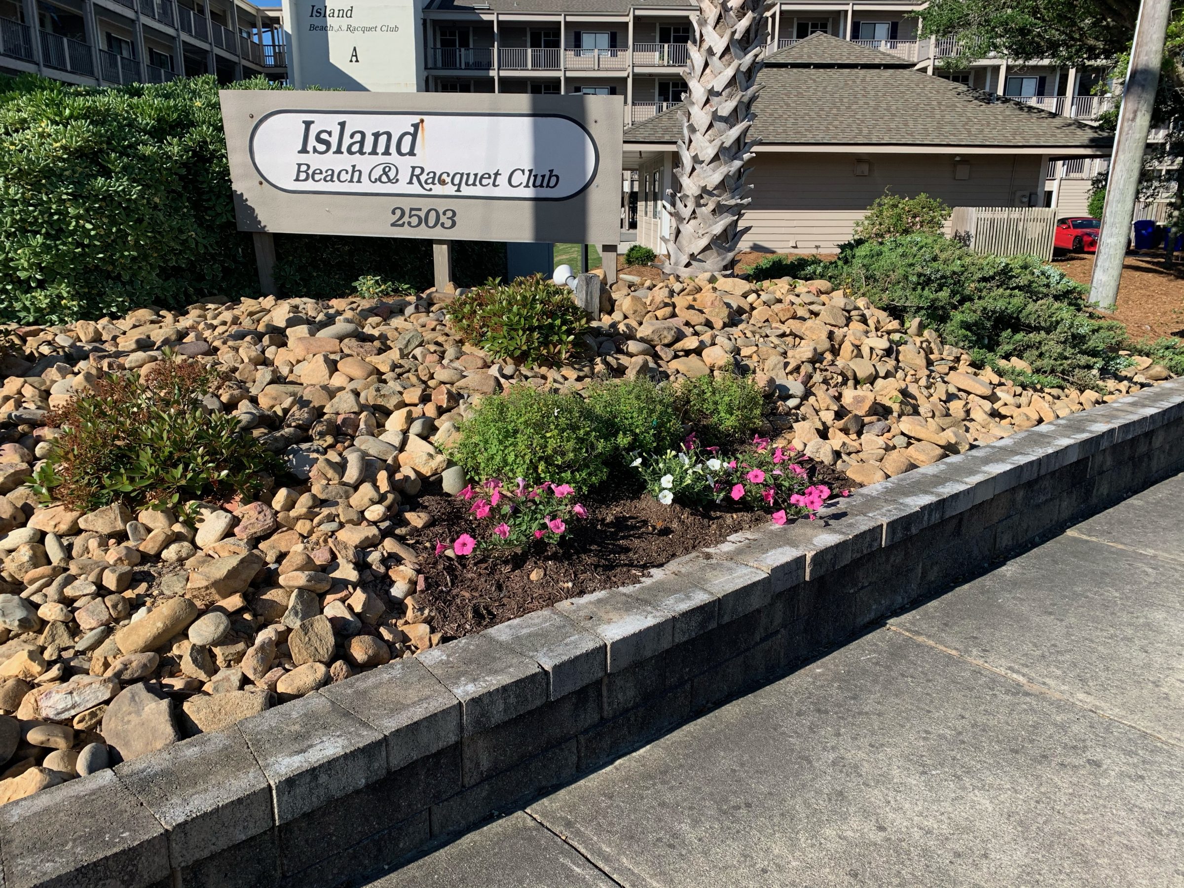 Island Beach & Racquet Club entrance sign and landscaping